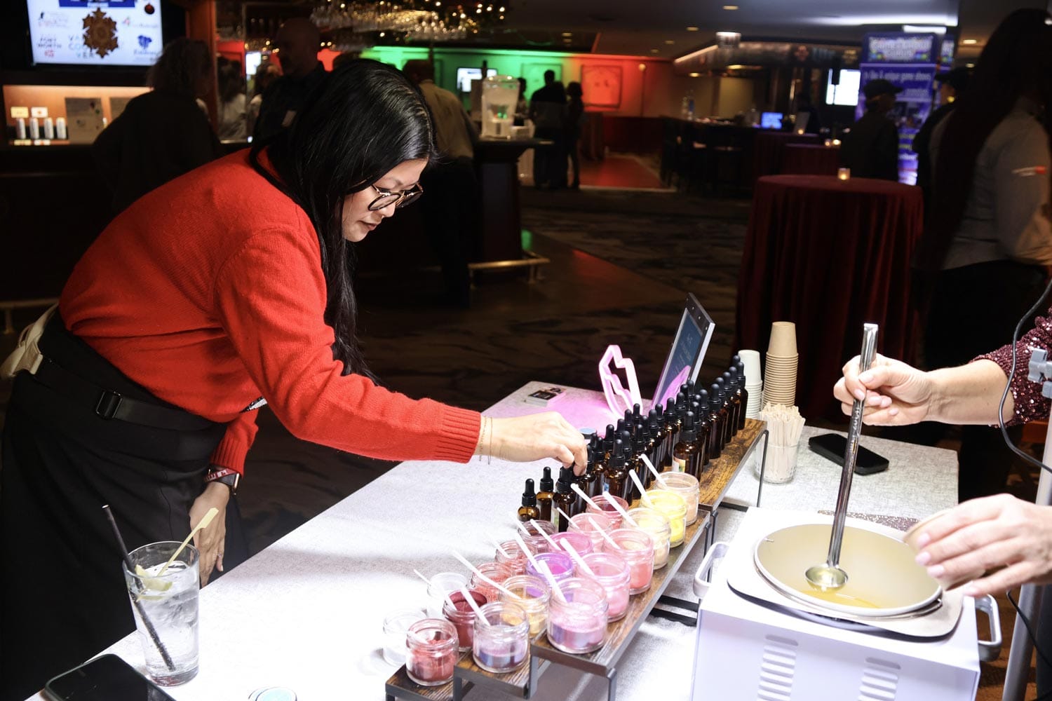 Woman serving beverages at a catering event.
